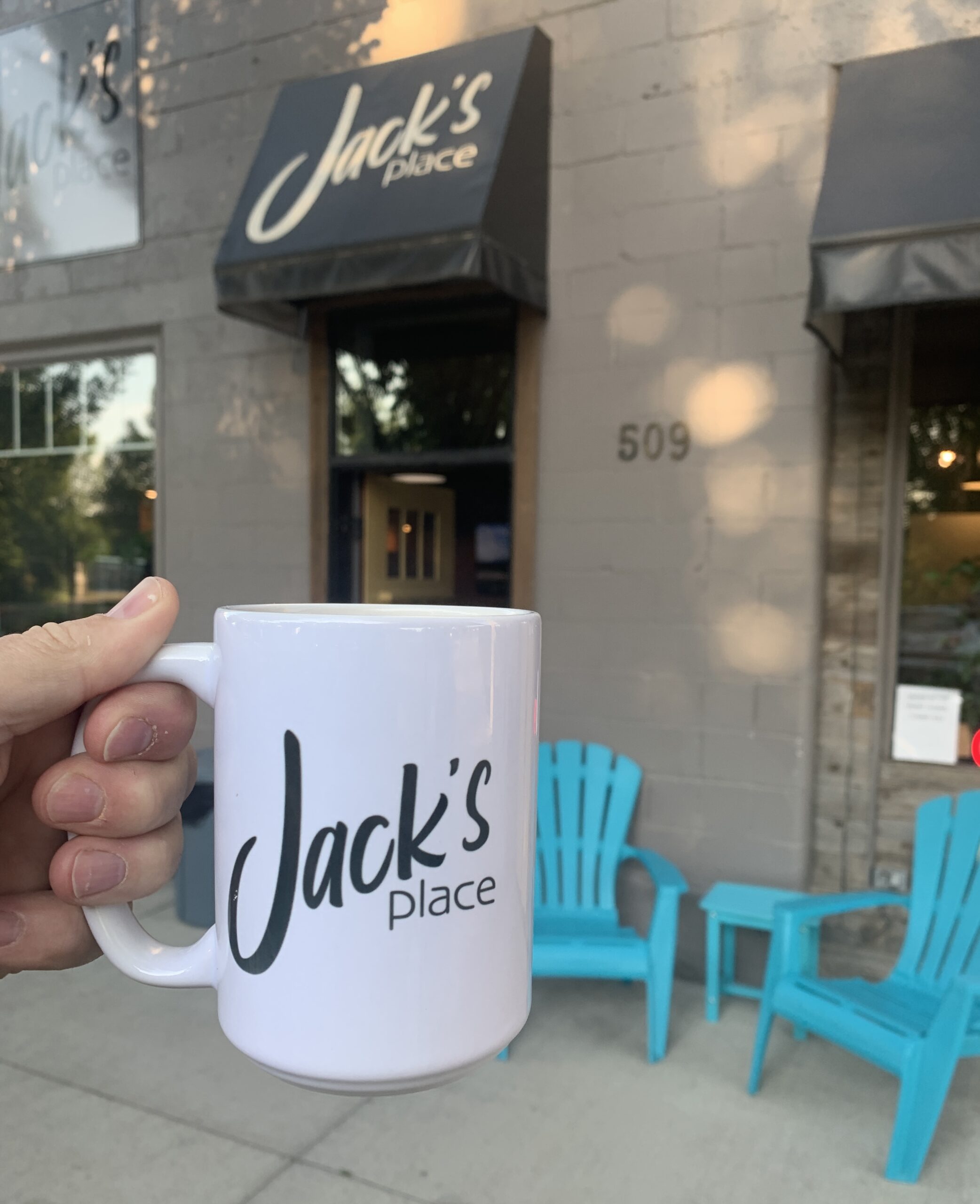Jack's Place coffee shop in High River Alberta — Shawn Selanders holding coconut coffee