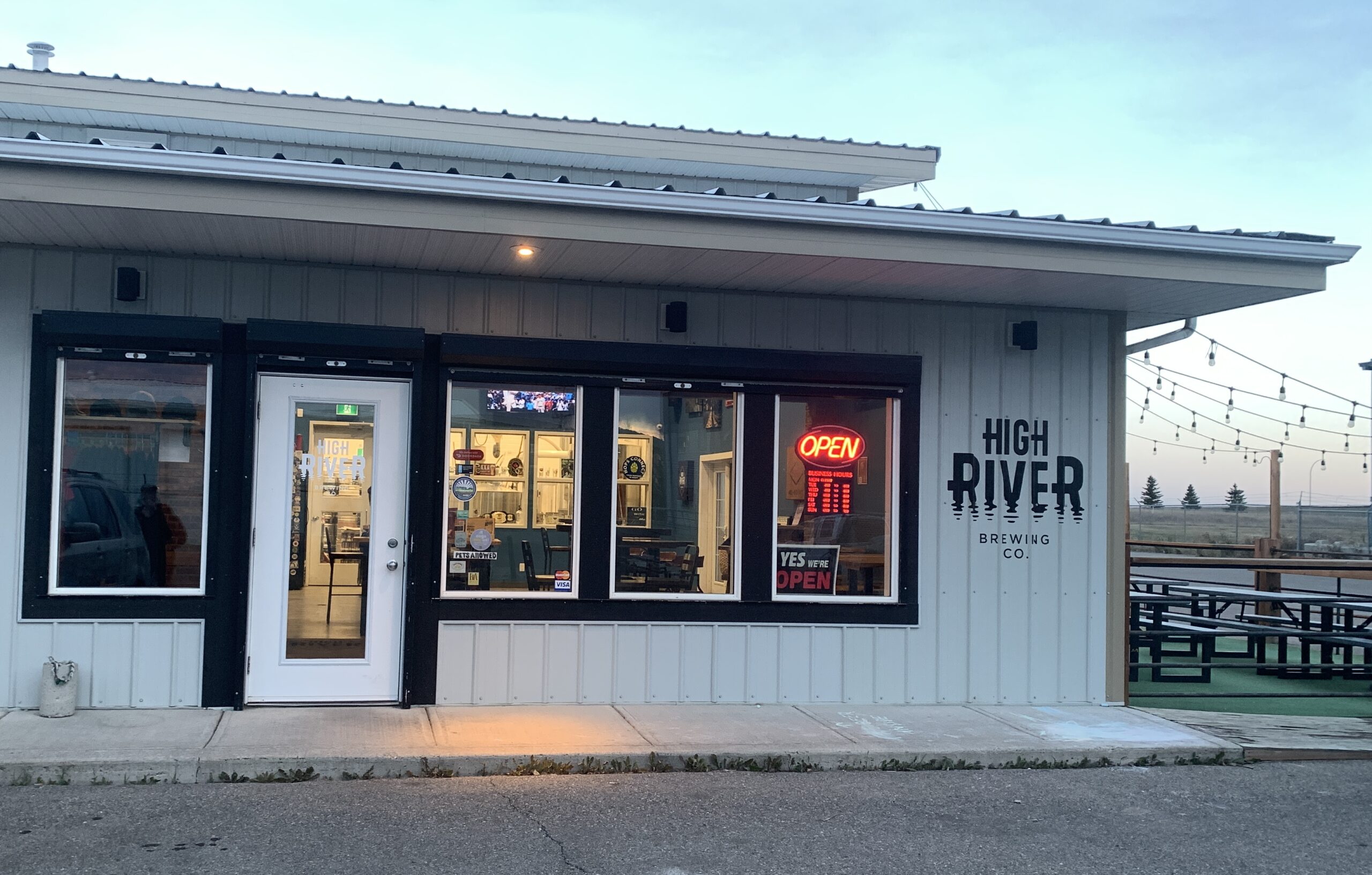 High River Brewing Company exterior with string lights and patio in High River Alberta