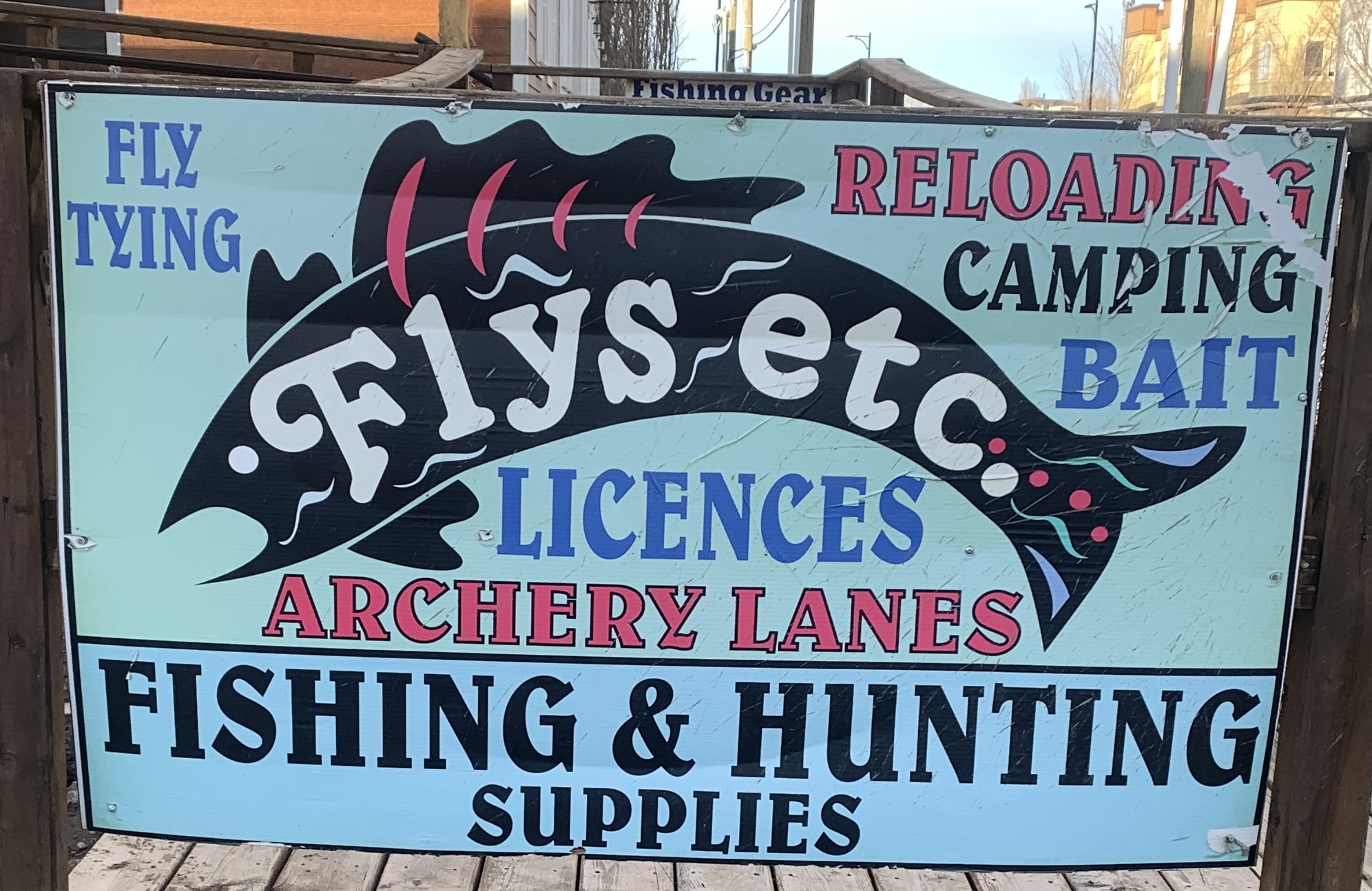 Flys Etc hunting and fishing store sign in High River Alberta